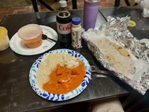 A table set with various dishes and drinks, showcasing a festive dining arrangement.